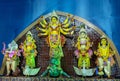 Goddess Durga idol at decorated Puja pandal, shot at colored light. Royalty Free Stock Photo