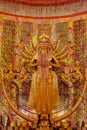 Goddess Durga idol at decorated Durga Puja pandal, shot at colored light, in Kolkata, West Bengal, India. Durga Puja is biggest