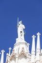 Goddess of Justice statue on the top of Doge`s Palace ,Venice, Italy