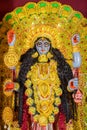 Idol of Goddess Maa Kali at a decorated puja pandal in Kolkata, India Royalty Free Stock Photo