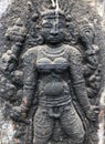 Goddess sculpture in angry pose. Bas relief sculpture carved in the stone walls at Shiva temple in Tamil nadu Royalty Free Stock Photo