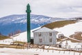 Goderdzi, Georgia - May 8, 2017. Georgian mosque with green minaret in mountains Royalty Free Stock Photo