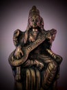 Godess Saraswati with sitar in low light