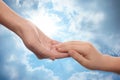 Godparent with child and beautiful blue sky with fluffy clouds on background, closeup