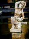 Godress sculpture in a Bali style garden Royalty Free Stock Photo