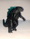 Godzila toy with angry face with shadow