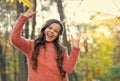 going crazy. child listen music in fall forest. enjoy elearning in headset. kid wear sweater in autumn park. happy kid Royalty Free Stock Photo