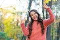 Going crazy. child listen music in fall forest. enjoy elearning in headset. kid wear sweater in autumn park. happy kid Royalty Free Stock Photo