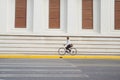 Going everywhere by his bike. Side view of young businessman loo Royalty Free Stock Photo