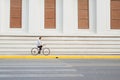 Going everywhere by his bike. Side view of young businessman looking forward while riding on his bicycle Royalty Free Stock Photo