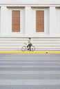 Going everywhere by his bike. Side view of young businessman looking forward while riding on his bicycle Royalty Free Stock Photo