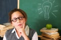 Going through the ideas in her mind. A cute brunette girl deep in thought in class. Royalty Free Stock Photo