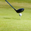 This is going to be a long drive. Closeup shot of a driver about to hit a golf ball resting on a tee. Royalty Free Stock Photo