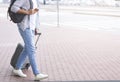 Tourist walking to transportation stop with luggage Royalty Free Stock Photo