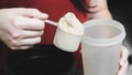 Going to pour casein protein powder into the cup. Royalty Free Stock Photo