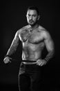 Going to punish you. Fashion model with leather belt. Man with tattoo. Bearded man with muscular torso. Sportsman with Royalty Free Stock Photo