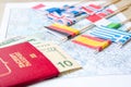 Going to travel. Passport, magnifier, red toy car and money on map. Save money on travel, planning for budget concept Royalty Free Stock Photo