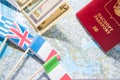 Going to travel. Passport, money, flags of Greece, UK, Italy, France on map. Save money on travel, planning for budget concept. Royalty Free Stock Photo