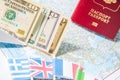 Going to travel. Passport, money, flags of Greece, UK, Italy, France on map. Save money on travel, planning for budget concept. Royalty Free Stock Photo