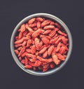 Goji berries in a bowl. Top view