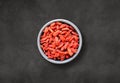 Goji berries in a bowl. Top view