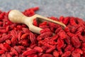 Goji berries close-up. Scoop with dried gougizi berries, selective focus