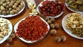 Goji berries, dried longans, red dates on wooden table, top view, Chinese herbs, dietary supplement Royalty Free Stock Photo
