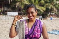 Indian woman jewelry seller portrait at Kudli beach resort in Gokarna city