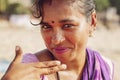 Indian woman jewelry seller portrait at Kudli beach resort in Gokarna city