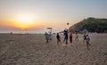 02/19/2019 Gokarna, India. Men of caucasian and indian ethnosity playing voleyball