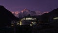 Beautiful view of illuminated lodges in small Sherpa village Gokyo in the evening light with purple colored sky.