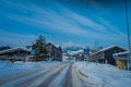 GOL, NORWAR, APRIL, 02, 2018: Gorgeous outdoor view of some buildings located at one side of the road with snow during Royalty Free Stock Photo