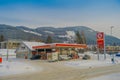 GOL, NORWAR, APRIL, 02, 2018: Outdoor view of some cars in a gas station, covered with snow in GOL Royalty Free Stock Photo