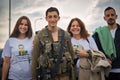 Golani soldier and his family smiling in the city of Golani Junction, Israel