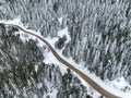 Golcuk - Bolu - Turkey, winter snow during snowfall. Travel concept drone photo. Highway, road in snowy tree landscape