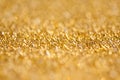 Gold abstract bokeh glitter texture background, filled with shiny gold glitter background. selective focus Royalty Free Stock Photo