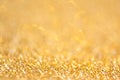 Gold abstract bokeh glitter texture background, filled with shiny gold glitter background. selective focus Royalty Free Stock Photo