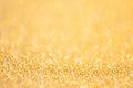 Gold abstract bokeh glitter texture background, filled with shiny gold glitter background. selective focus Royalty Free Stock Photo