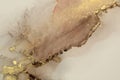Gold Abstract watercolor and acrylic flow blot painting. Color canvas marble texture background. Alcohol ink
