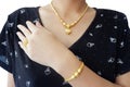 Gold accessories or Gold jewelry such as necklaces, rings and bracelets on body of woman Which is beautiful when on a woman`s bod