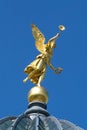 Gold angel on the blue sky Royalty Free Stock Photo