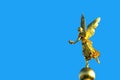 Gold angel statue blue background Royalty Free Stock Photo