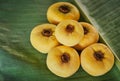 Gold Apple EBENACEAE on banana leaf Royalty Free Stock Photo