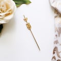 Gold Arrow Hair Pin On White Shirt: Tabletop Photography With A Touch Of Romance