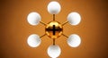 Gold atom model with white spheres and black plus sign Royalty Free Stock Photo