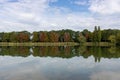 Gold autumn forest reflected in lake in Frankenthal, Germany Royalty Free Stock Photo