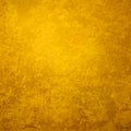 Gold background with distressed vintage grunge texture, old dark yellow design that is elegant