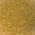 Gold background shiny glitter texture brilliant pattern. Beauty