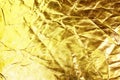 Gold background or texture and shadow. Gold fabric crease