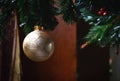 Gold ball Christmas ornament on tree